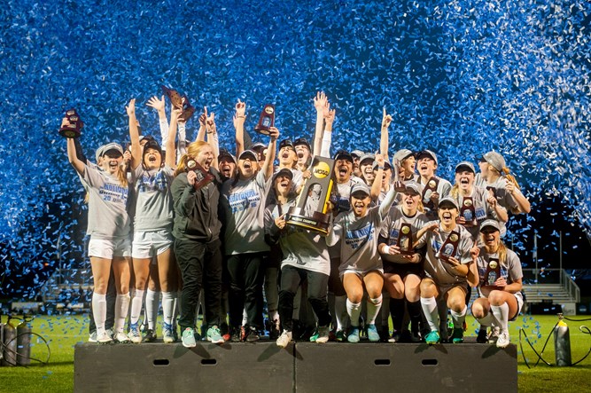 2016 Women's soccer team celebrating on the podium