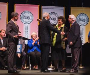 Photo of Trula Nicholas and Joseph Trimble receiving award