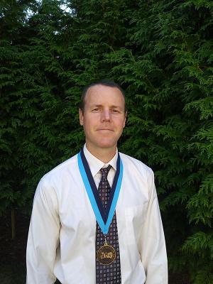 Greg O'Neil from Chemistry wearing his award medallion