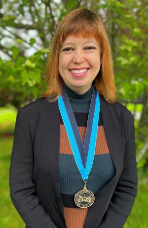 Melissa Rice wearing WWU award medallion