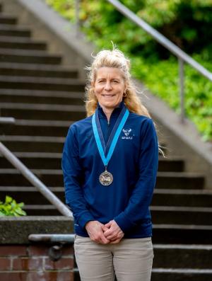 Julie Weisgerber wearing a WWU award medallion