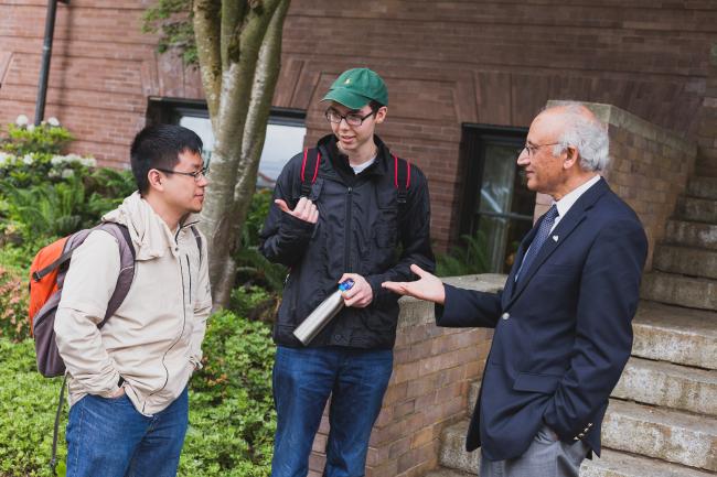 President Sabah talking with two students in front of Old Main